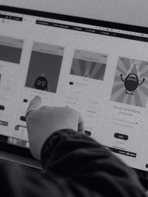 UI mockups reviewed on a laptop screen